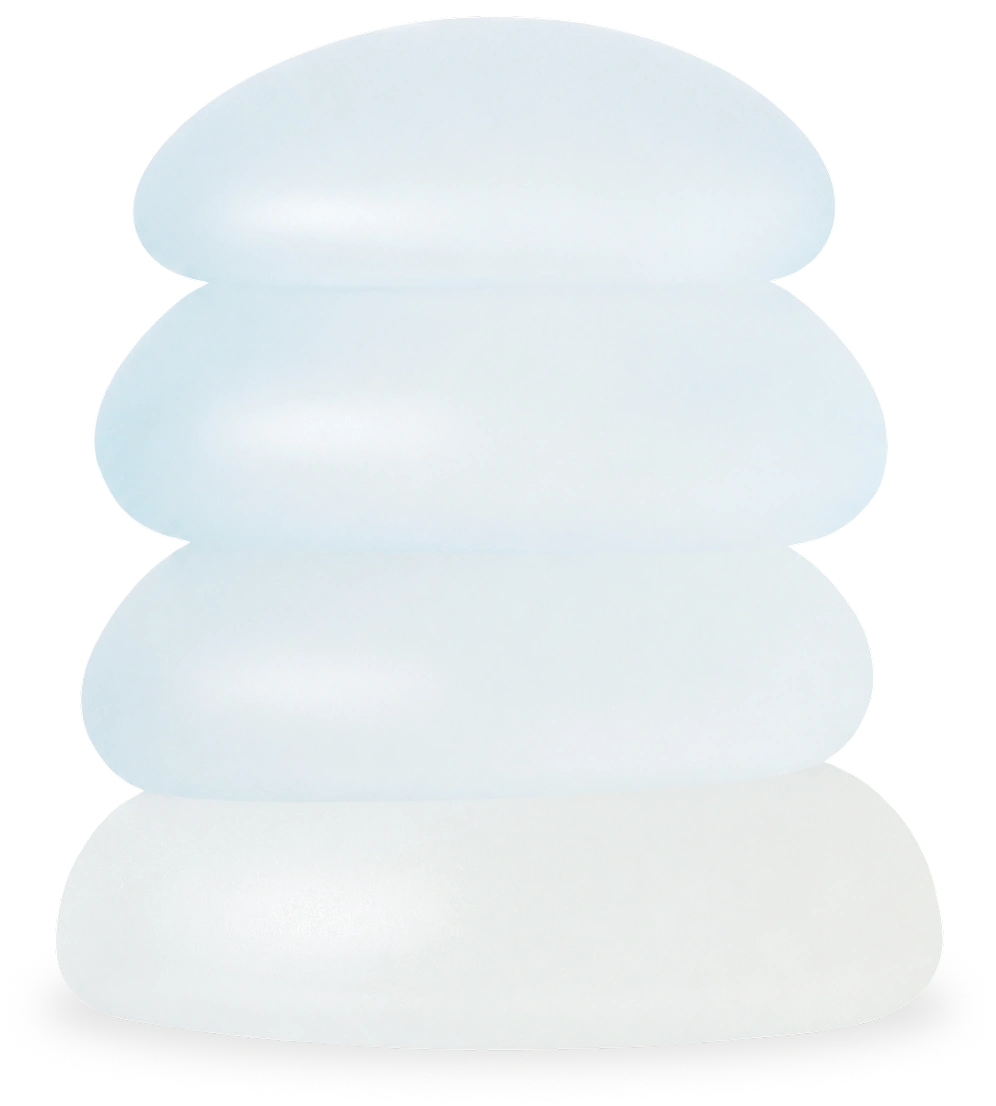 Stack of four Motiva silicone breast implants demonstrating Mini, Demi, Full, and Corsé projection profiles.
